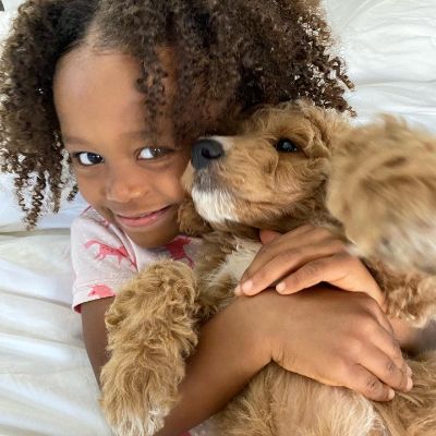 Keshia Knight Pulliam's little daughter, Ella Grace Hartwell holding Huey P.